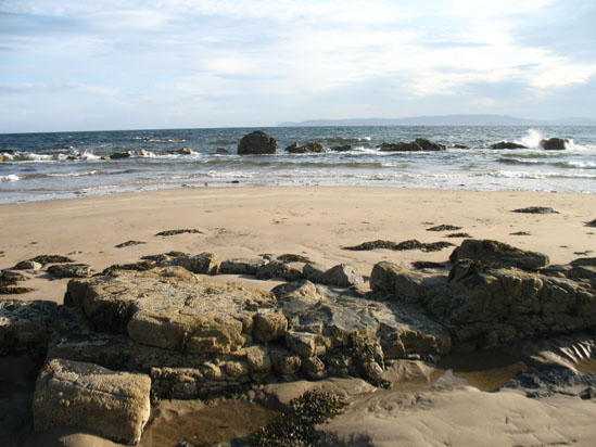 Picture of   Blackwaterfoot beach with the tide out is shown on this page.