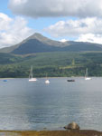 Goatfell from Brodick Beach with sailboats