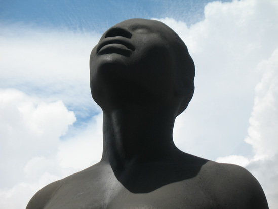 Picture of  The  Redemption Song Monument Female Head Closeup at Emancipation Park, Kingston, Jamaica is shown on this page.
