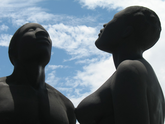 Picture of  The  Redemption Song Monument Heads Closeup at Emancipation Park, Kingston, Jamaica is shown on this page.