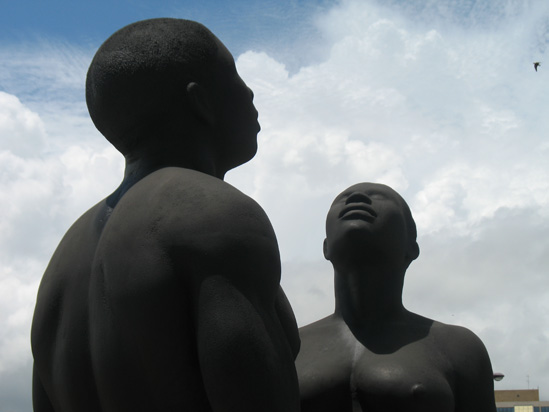 Picture of  The  Redemption Song Monument Heads Closeup at Emancipation Park, Kingston, Jamaica is shown on this page.