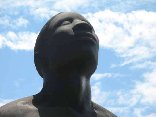 Picture of  The  Redemption Song Monument Male Head Closeup at Emancipation Park, Kingston, Jamaica is shown on this page.