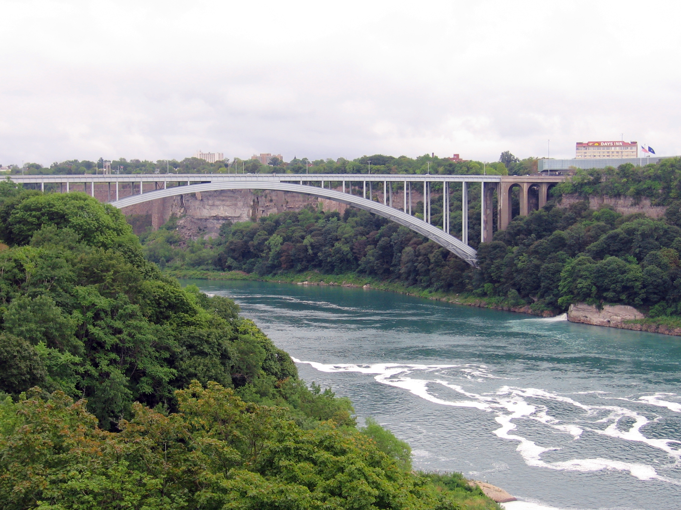 Picture of  The  Rainbow Bridge At Niagara Falls Ontario New York  is shown on this page.