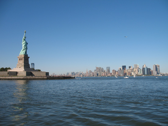 Picture of  The Statue of Liberty and the Manhattan Skyline is shown on this page.