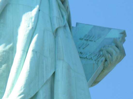 Picture of  The Tablet of The Statue of Liberty is shown on this page.