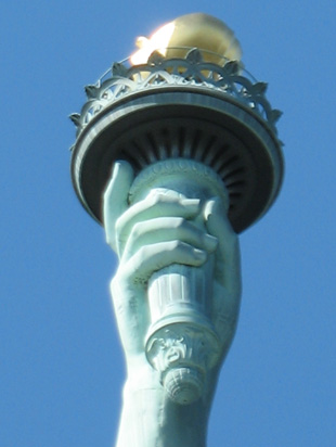 Picture of  The Statue of Liberty Torch is shown on this page.